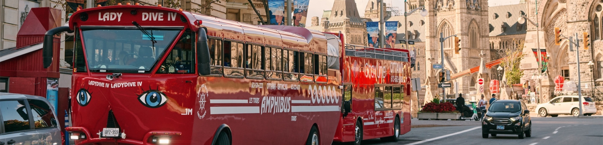 red bus driving down the street
