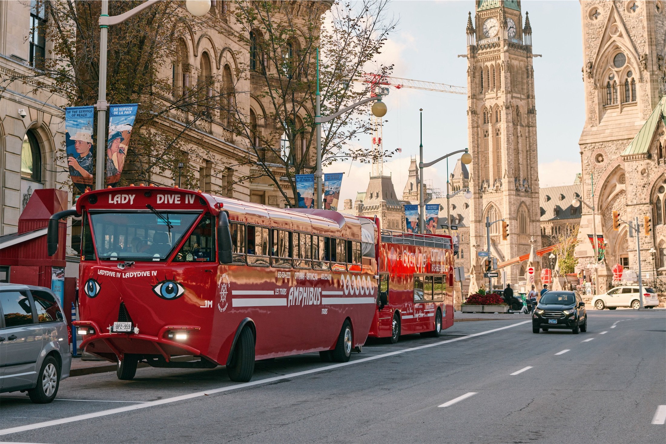 red bus driving down the street