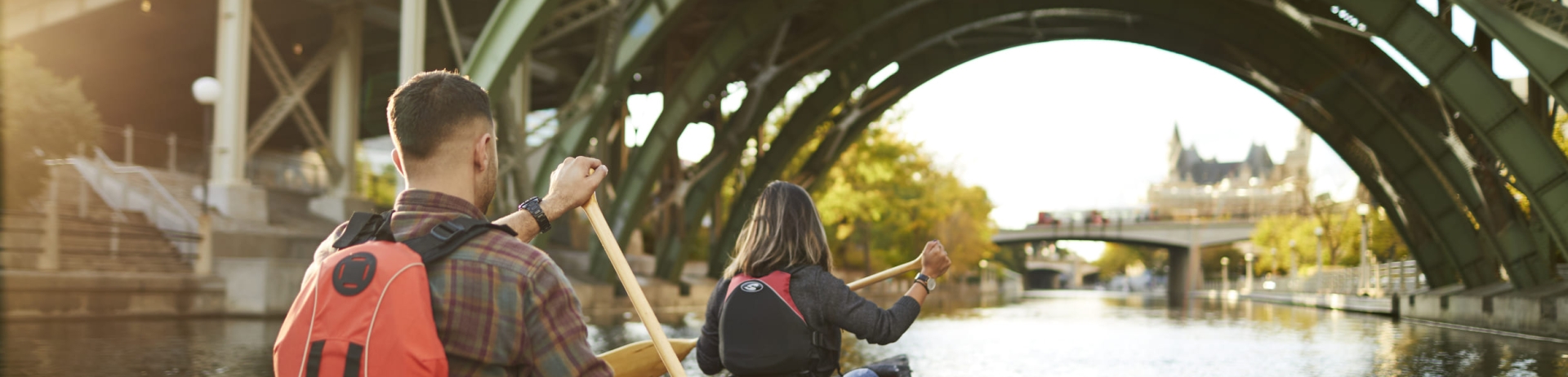 A couple paddling a canoe down the Rideau Canal