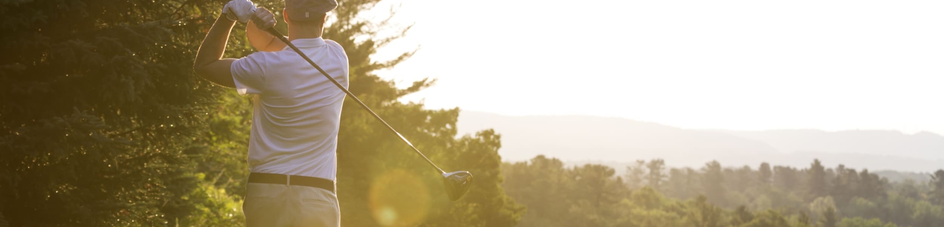 man swinging a golf club