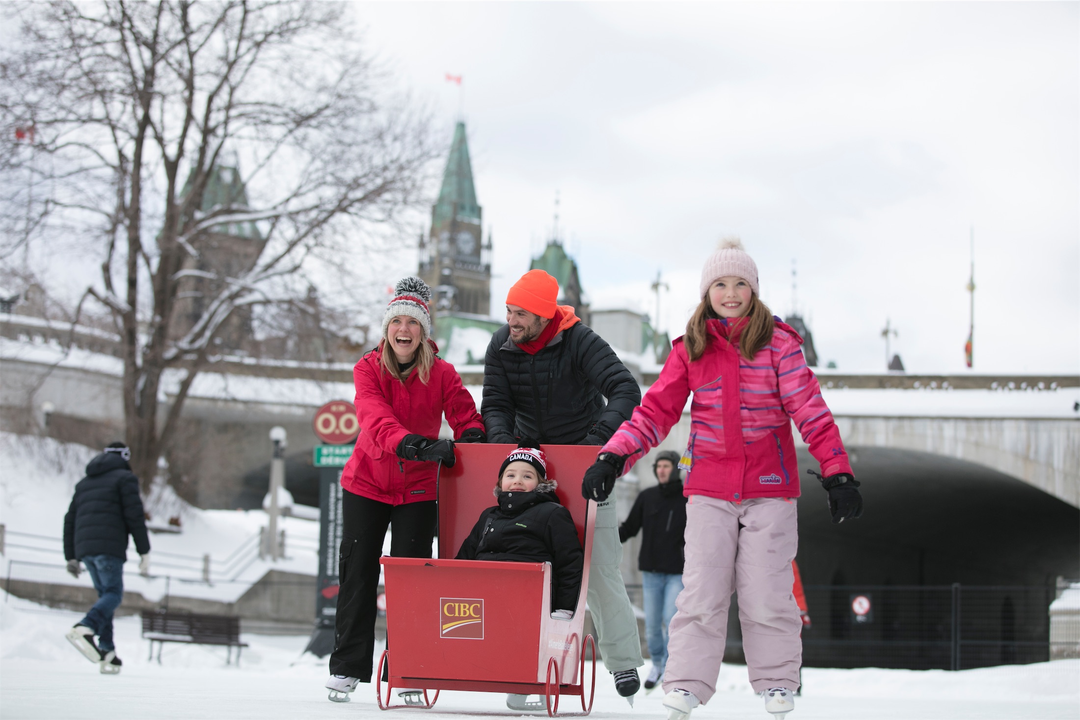 A Family on the Rideau Canal Skateway with a Sledge